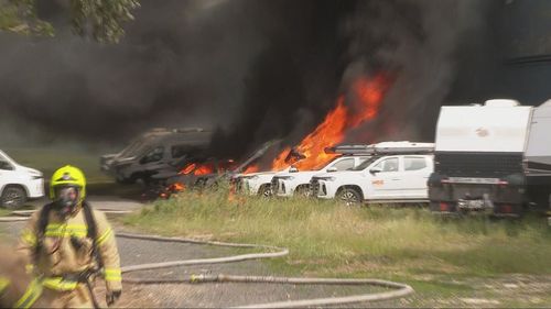 Cars on fire after a factory fire in Matraville.