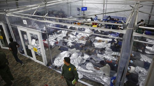 Minors are shown inside a pod at the Donna Department of Homeland Security holding facility, the main detention centre for unaccompanied children in the Rio Grande Valley run by US Customs and Border Protection (CBP) in March 2021.
