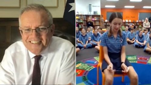 Prime Minister Scott Morrison chats to schoolchildren from St Peter's Chanel in Brisbane.