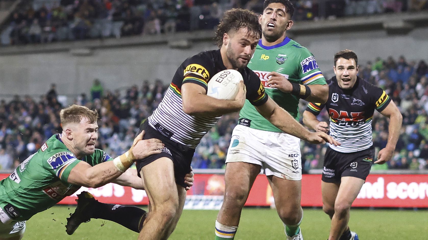 Jaeman Salmon of the Panthers scores a try against the Raiders.