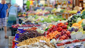 Stock image of fruit and vegetables at a grocery store or market.