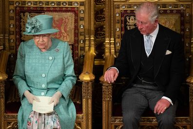 Queen Elizabeth II and the Prince of Wales sit in the chamber, during the State Opening of Parliament in 2019.