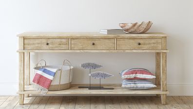 Interior in coastal style. Console table near empty white wall. Interior mockup. 3d render.