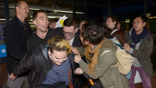 Protesters scuffled with guards ahead of Mr Pyne's speech. (AAP)