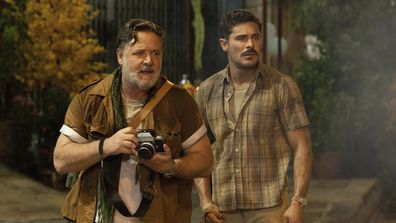 This image released by Apple TV+ shows Russell Crowe, left, and Zac Efron in a scene from The Greatest Beer Run Ever.
