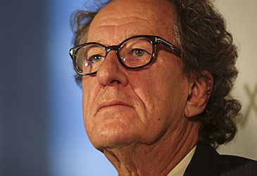 Which publication is Geoffrey Rush suing for defamation?