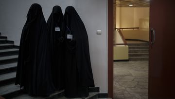 Women stand inside an auditorium at Kabul University&#x27;s education centre during a demonstration in support of the Taliban government in Kabul, Afghanistan, Saturday, September 11, 2021.