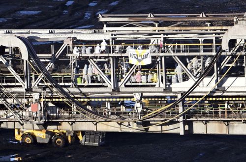 Activists occupy a bucket-wheel excavator at the Inden opencast lignite mine, Germany, Tuesday, Jan. 17, 2023.
