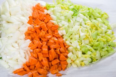 mirepoix: Ingredients for soup making with carrots, onions and celery chopped