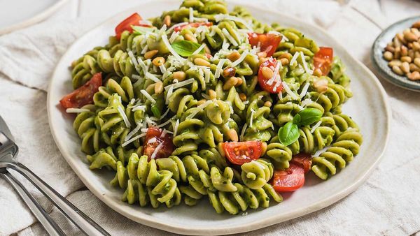 Avocado pesto pasta with cherry tomatoes