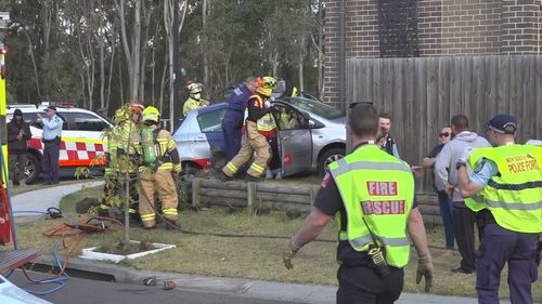 Une femme a été inculpée après que sa voiture a heurté un homme et s'est écrasée dans une maison à Schofields, Sydney.