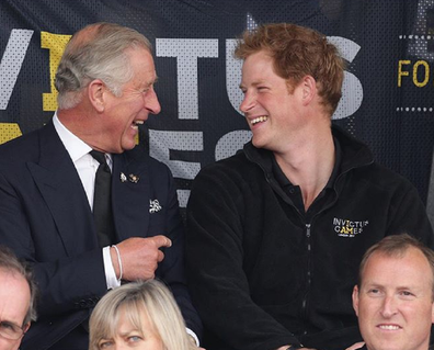 Prince Charles and Prince Harry at an Invictus Games event in 2014.