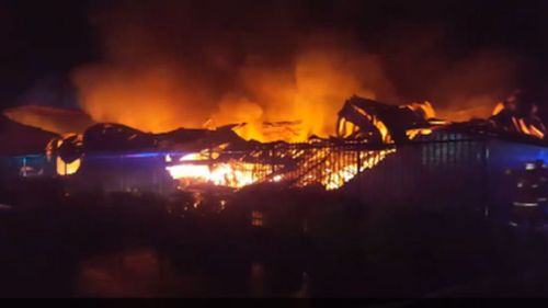 Firefighters battle large factory fire in Sydney's west