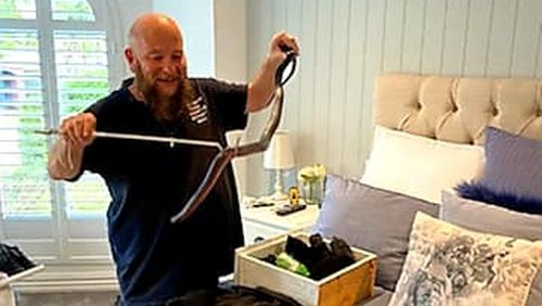 Barry Goldsmith, from The Snake Catcher Victoria, was called to the man's home to collect and relocate the red-bellied black snake yesterday.