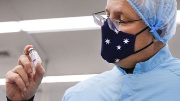 Prime Minister Scott Morrison holding a vial of the AstraZeneca vaccine in Melbourne in February.