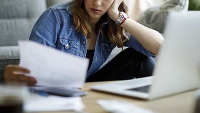 Woman reading her financial records