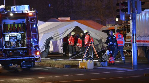 Emergency services attend an incident at the Christmas market in Magdeburg, Germany, Friday Dec. 20, 2024. (Heiko Rebsch/dpa via AP)