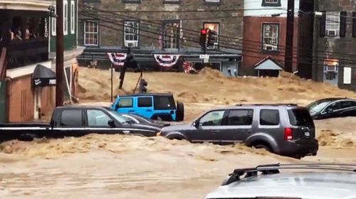 Water rushes through Main Street in Ellicott City, Maryland. (Photo: AP).