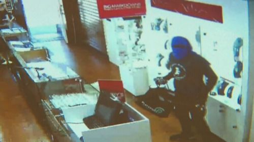 Masked men stormed the Elsternwick shop, smashing the cabinets with hammers. (9NEWS)