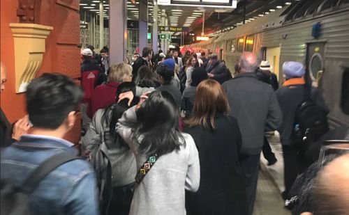 Sydney train commuters are experiences delays of up to an hour after 'urgent wiring repairs' at Wynyard station has led to a communications failure.