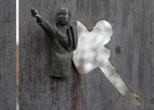 Martin Luther King Jr reaches out from one of the panels of the memorial "Landmark for Peace" commemorating the site where Robert Kennedy delivered his immortal words on the night of King's assassination. (AAP)