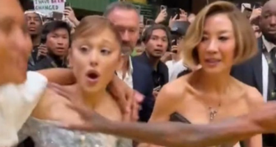 Ariana Grande grabbed by fan on red carpet