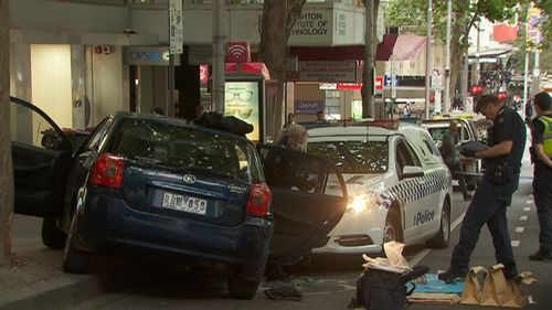 Ireland's stolen Corolla mounted the pavement after hitting the police car. (9NEWS)