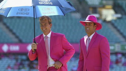 Wide World of Sports commentators Brett Lee and Shane Warne in their finest pink suits. (Getty)