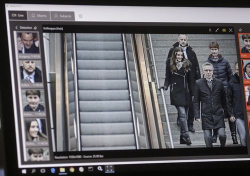 A computer with an automatic facial recognition system shows German commuters in the Suedkreuz train station in Berlin.