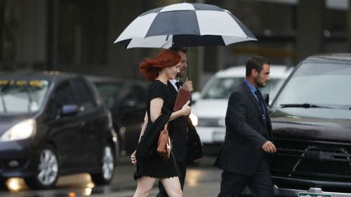 Tree Paine, publicist for pop singer Taylor Swift, walks back to a hotel after attending the jury selection phase in a civil trial in federal court on Monday. (AAP)