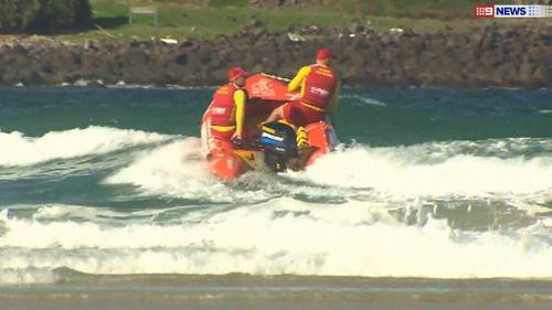 Lifesavers responded after a group was washed off rock at Fingal Head. (9NEWS)