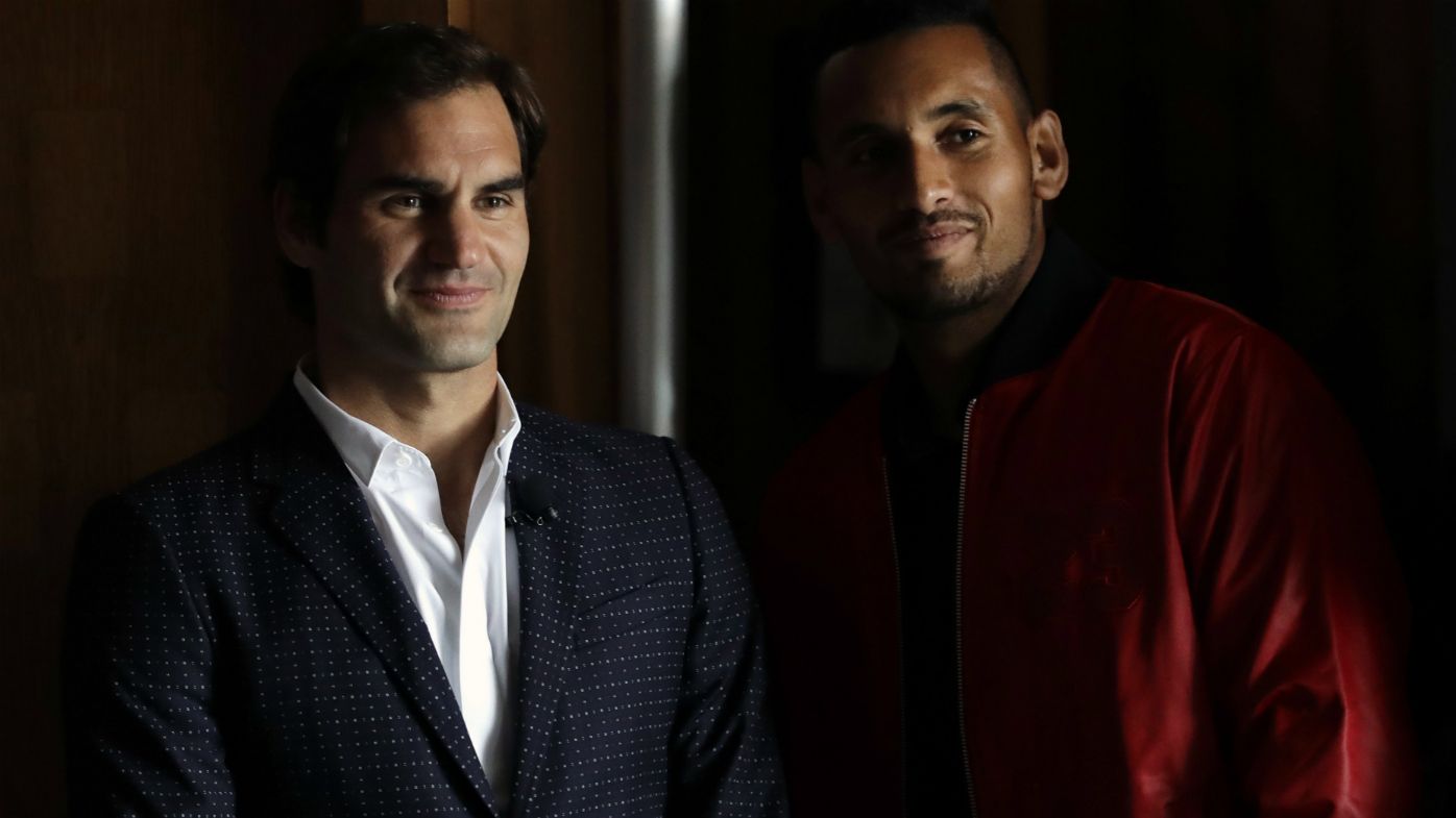 Roger Federer, left, and Nick Kyrgios watch a highlight video from the 2017 Laver Cup during a promotional news conference for the tournament Monday, March 19, 2018, in Chicago