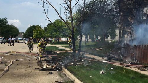 Pilot dies after light plane crashes into residential Chicago road