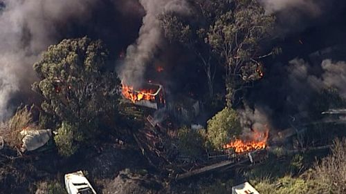 Fire carves a trail of destruction near Penrith, in Sydney's West. (9NEWS)