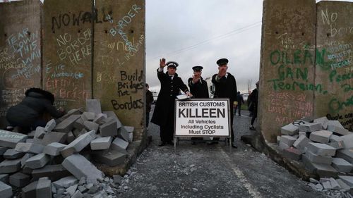 Actors pose as border police at a protest in Carrickcarnan on the Ireland border.