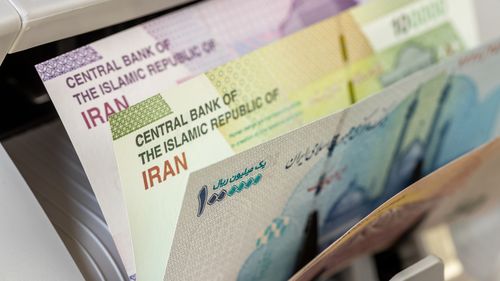 Iran, rial banknotes. Money counting machine with Iranian currency. Financial concept. close up