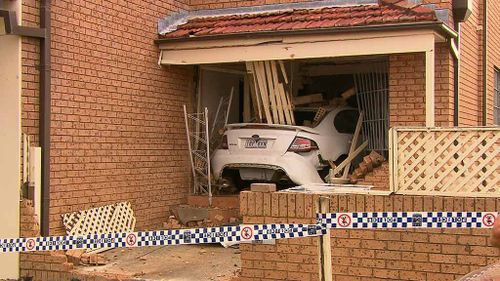 Four people were at home when the car allegedly smashed into their Bexley home. No one was injured. (9NEWS)