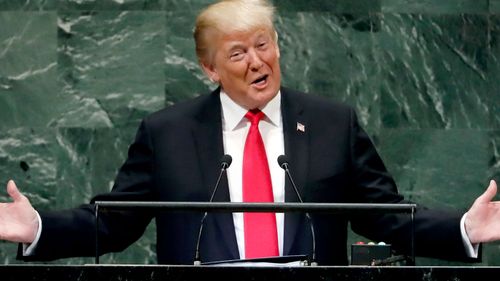 US President Donald Trump grins as he addresses the UN General Assembly.