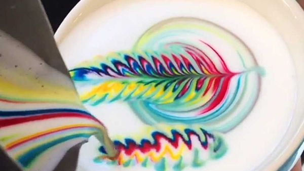 Emily Coumbis, head barista at Piggyback Café, has made waves with her stunning rainbow coffee art