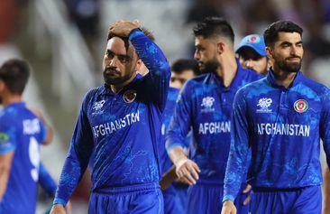 Rashid Khan of Afghanistan looks dejected while leaving the field after the team&#x27;s defeat in the ICC Men&#x27;s T20 Cricket World Cup West Indies &amp; USA 2024 Semi-Final match between South Africa and Afghanistan at Brian Lara Cricket Academy on June 26, 2024 in Tarouba, Trinidad And Tobago. (Photo by Robert Cianflone/Getty Images)
