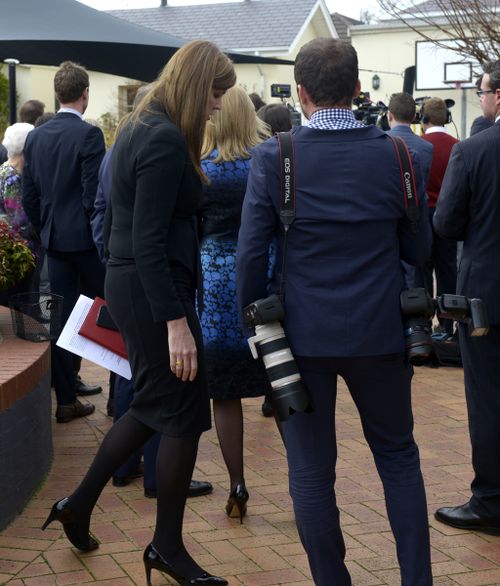 Ms Credlin leaves the station with the media. (AAP)