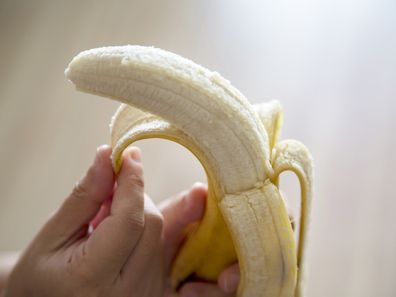 hand peeling banana
