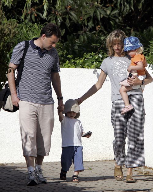 Gerry and Kate McCann, the parents of the missing 3-year-old girl Madeleine McCann, walk with their twins outside their resort apartment on May 11 2007, in Praia da Luz, southern Portugal.