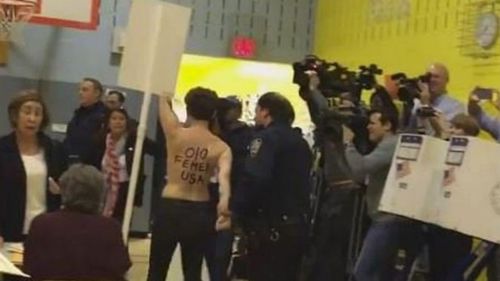 Two women protested against Donald Trump at his polling station in Manhattan. (Femen/Twitter)