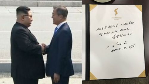 After a historic handshake between the two leaders, Kim signed the guest book at the Peace House summit venue. (AAP)