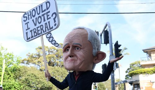 A protester dressed as former prime minister Malcolm Turnbull is seen at a polling place at Bellevue Hill.