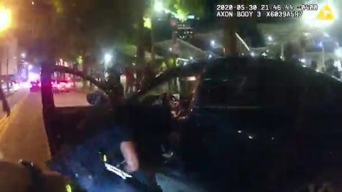 Bodycam video shows Atlanta police yank students out of car