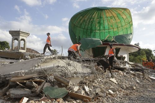 Authorities are struggling to clear the rubble and search for survivors without heavy machinery. Picture: AP.