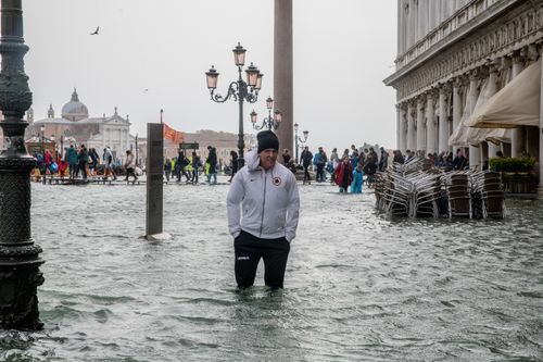 Tourists and locals are donning high boots to navigate the streets.