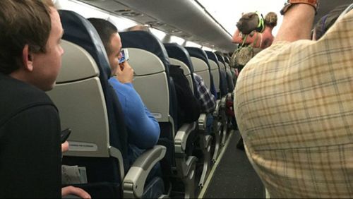 Rachel Boerner and her 'emotional support pig' are escorted off a US Airlines flight after the animal misbehaved. (Rob Phelps)